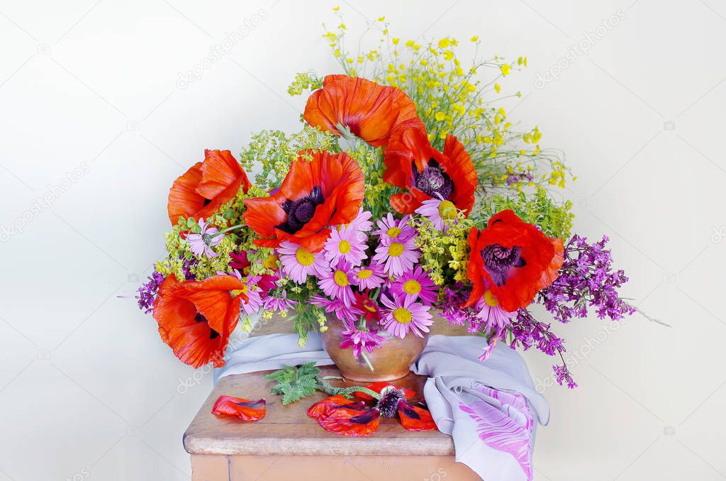 Bouquet with red poppies in a vase isolated on white background