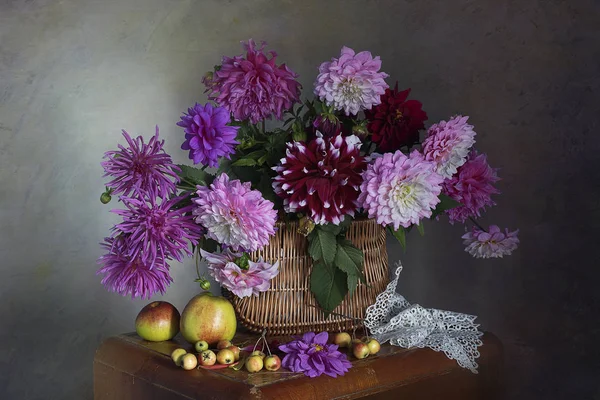 Still life with pink dahlias isolated on brown background