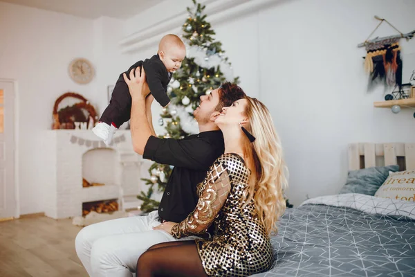 Family near Christmas tree — Stock Photo, Image