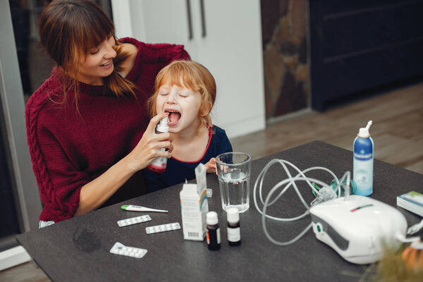 Mother treats her daughter at home