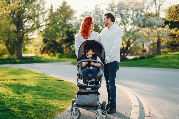 Cute family in a sunny park — Stock Photo, Image