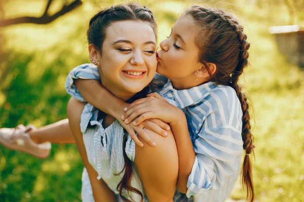 Beautiful mother with pretty daughter — Stock Photo, Image