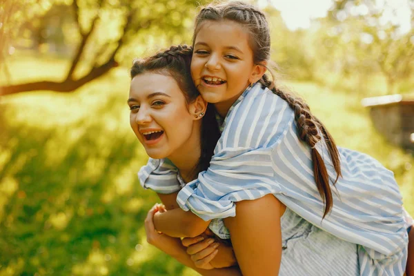 Beautiful mother with pretty daughter — Stock Photo, Image