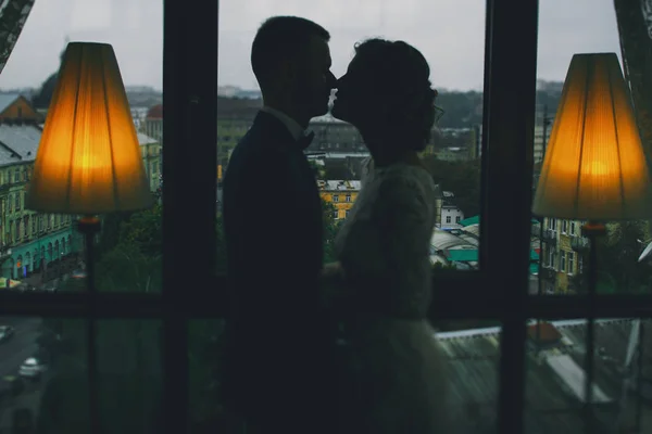 Groom and bride in a hotel — Stock Photo, Image