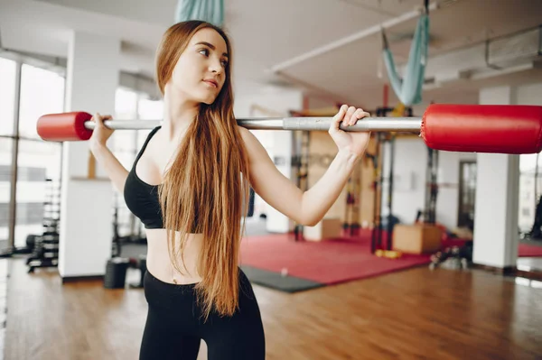 Sports girl in a morning gym — Stock Photo, Image
