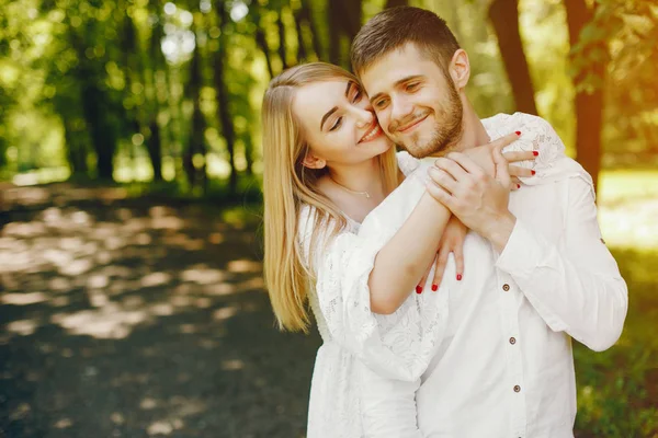 Elegant couple in a forest — Stock Photo, Image
