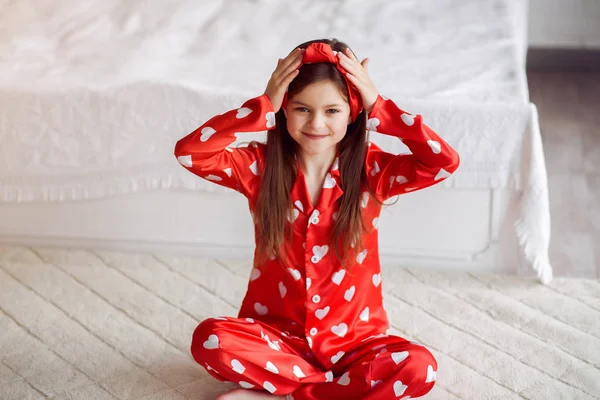 Cute little girl at home in a pajamas — Stock Photo, Image