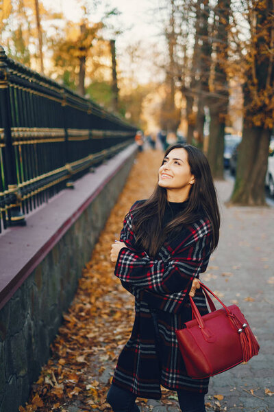 stylish girl walking through the city