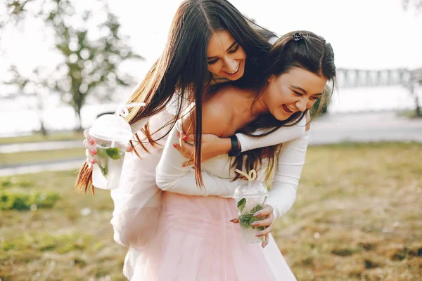 Two pretty girls in a summer park — Stock Photo, Image