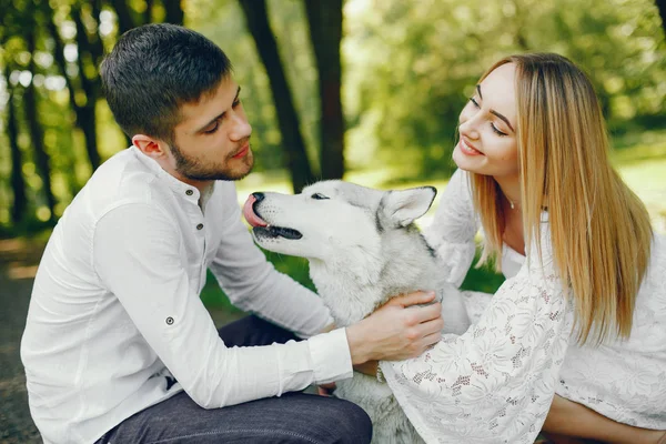 Elegant couple in a forest — Stock Photo, Image