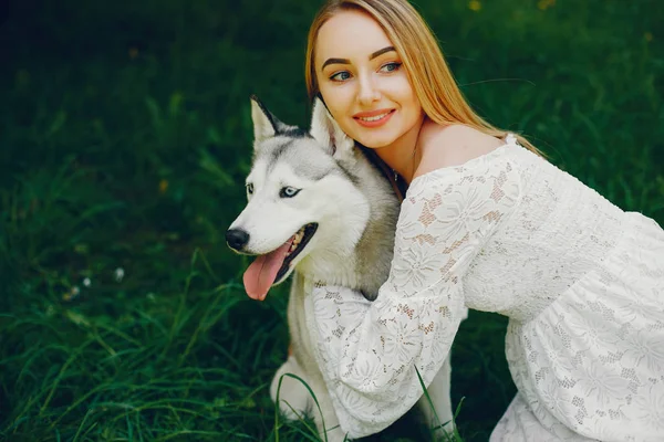 Elegant girl with cute dog — Stock Photo, Image