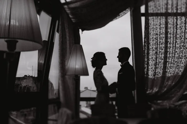 Groom and bride in a hotel — Stock Photo, Image