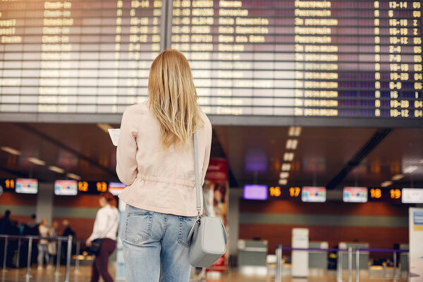 Beautiful girl standing in a airport