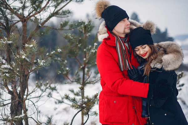 Loving couple walking in a winter park