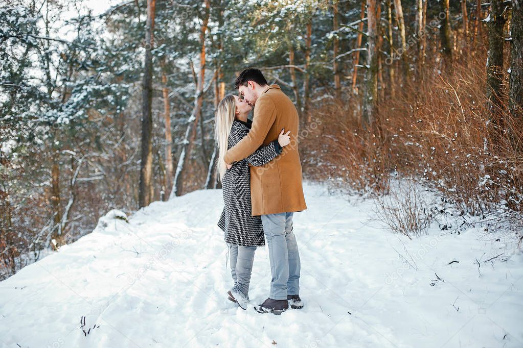 happy couple walking through the park