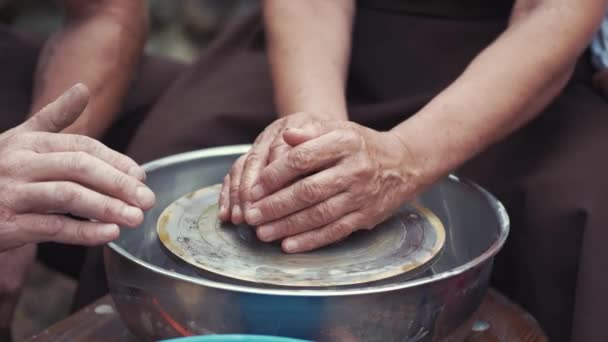 Close up hands make pitchers in pottery — Stock Video