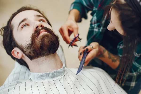 Stylish man sitting in a barbershop — Stock Photo, Image