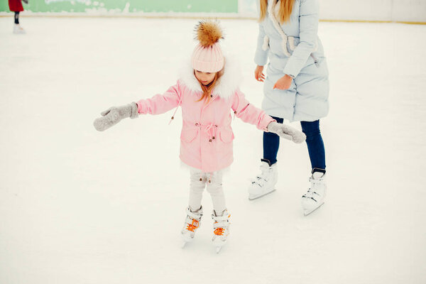 Cute and beautiful family in a winter city