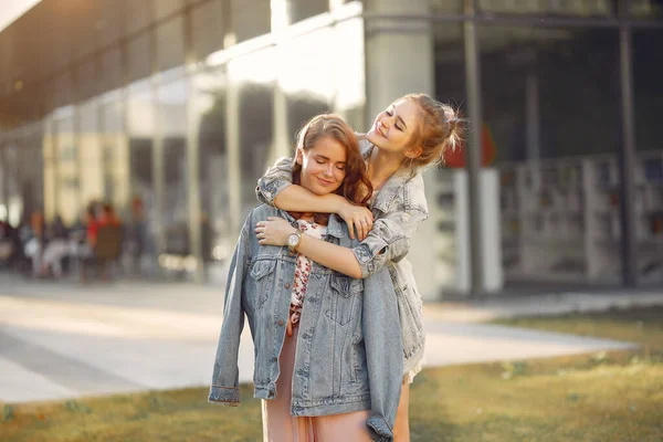 Elegant and stylish girls in a summer park — Stock Photo, Image