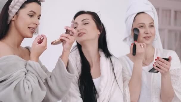 Gorgeous women friends are doing morning make-up and talking — Stock Video