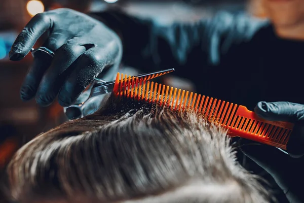 Stylish man sitting in a barbershop — Stock Photo, Image