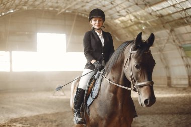 The rider in black form trains with the horse