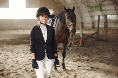 The rider in black form trains with the horse