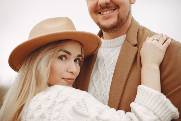 Beautiful couple spend time in a autumn field — Stock Photo, Image