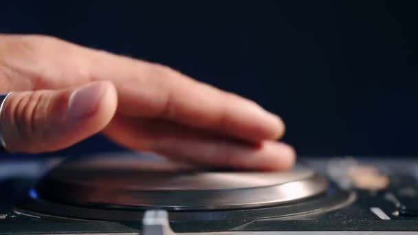 Close up of DJ hands controlling a music table in a night club — Stock Video