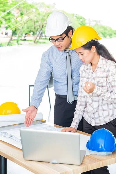 teamwork businessman and engineer in cafe outdoor with laptop computer,