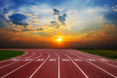 Statistical columns of chart shows the growth of the business from 2018-2025 Running Track on the morning sunset clipart