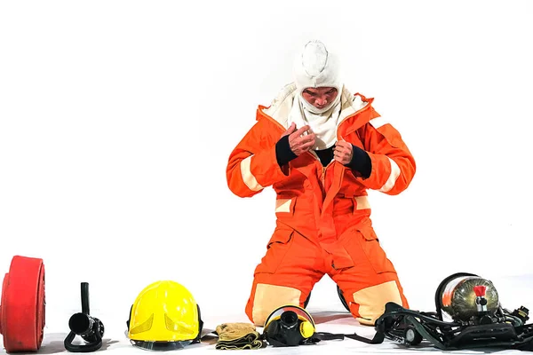 Firefighter demonstrates wearing uniforms, helmets and various e — Stock Photo, Image