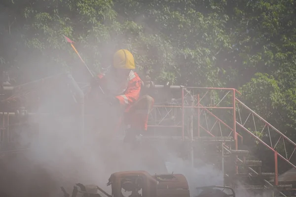 Firefighter are using fire hatchet job