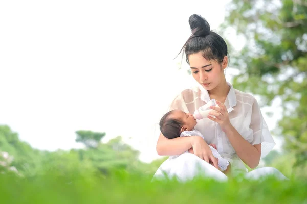 A 2 month old Asian baby is happy to suck breast milk. Stock Photo by  ©subinpumsom 280804802