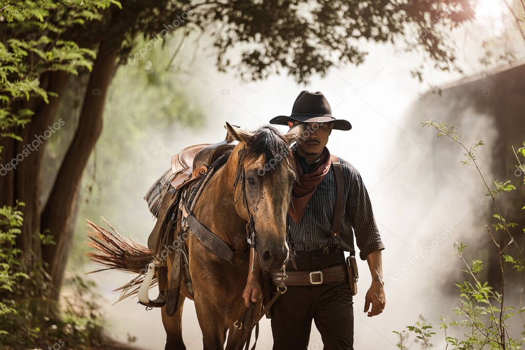 Horse and the cowboy  in the morning sunrise