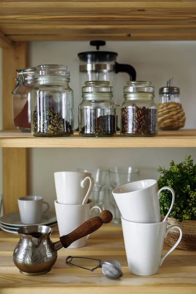 Dish on open shelves in kitchen