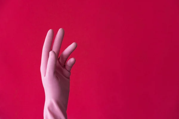 Pink left hand on red