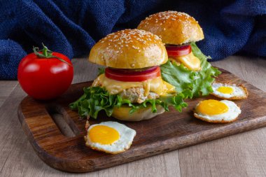 burgers on a wooden background