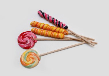 colored lollipops on a light background