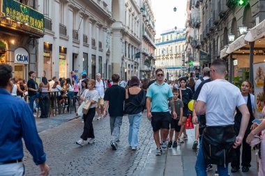 Naples, Italy - September 12, 2025: Citizens and tourists stroll along the central Via Toledo, an important landmark for visiting the city's historic center.