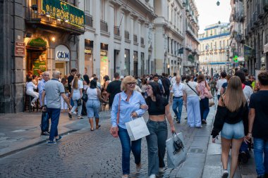 Naples, Italy - September 12, 2025: Citizens and tourists stroll along the central Via Toledo, an important landmark for visiting the city's historic center.
