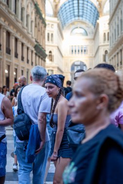 Naples, Italy - September 12, 2025: People stroll inside the majestic Galleria Umberto I, a historic monument.