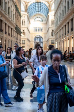Naples, Italy - September 12, 2025: People stroll inside the majestic Galleria Umberto I, a historic monument.