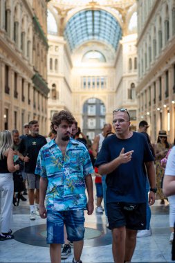 Naples, Italy - September 12, 2025: People stroll inside the majestic Galleria Umberto I, a historic monument.