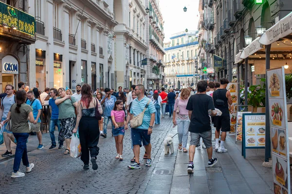Naples, Italy - September 12, 2025: Citizens and tourists stroll along the central Via Toledo, an important landmark for visiting the city's historic center.