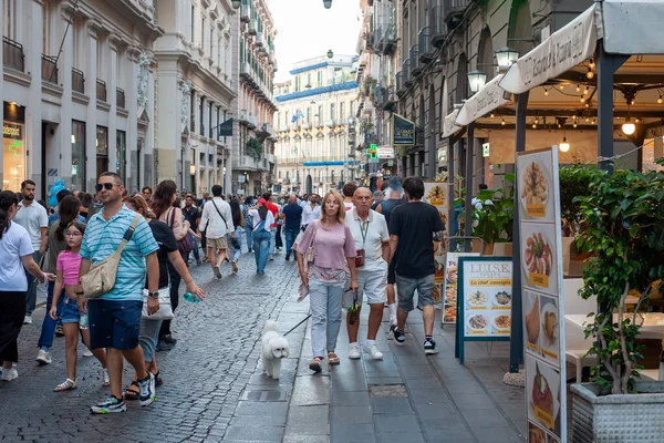 Naples, Italy - September 12, 2025: Citizens and tourists stroll along the central Via Toledo, an important landmark for visiting the city's historic center.