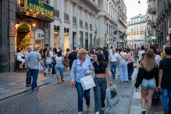 Naples, Italy - September 12, 2025: Citizens and tourists stroll along the central Via Toledo, an important landmark for visiting the city's historic center.