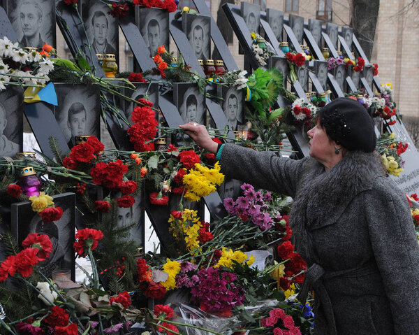 Laying flowers at the Alley of Heroes of the Heavenly Hundreds in Kiev, February 20, 2018. Memorial events for the Day of Heroes of the Heavenly Hundreds are held in Kiev on February 18-20