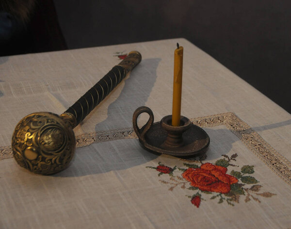 Hetman's mace and a candle on the table 