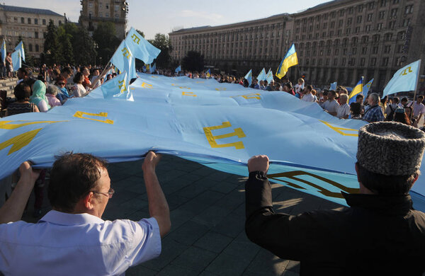 Participants of the procession on the occasion of the Day of the Crimean Tatar flag, in the center of Kiev, June 26, 2017.